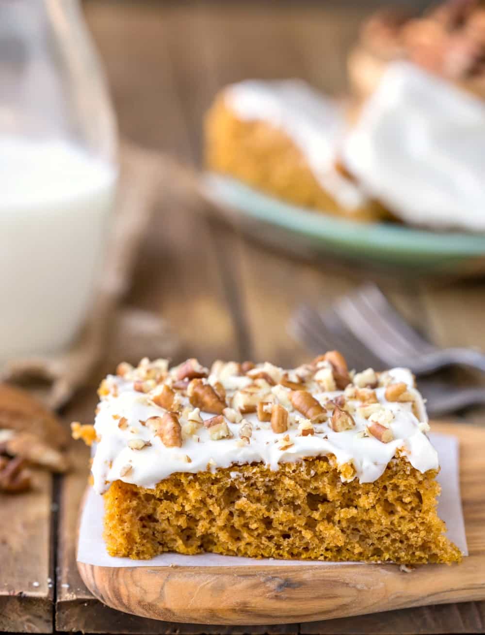 Pumpkin Bar on a piece of white parchment paper on a wooden cutting board