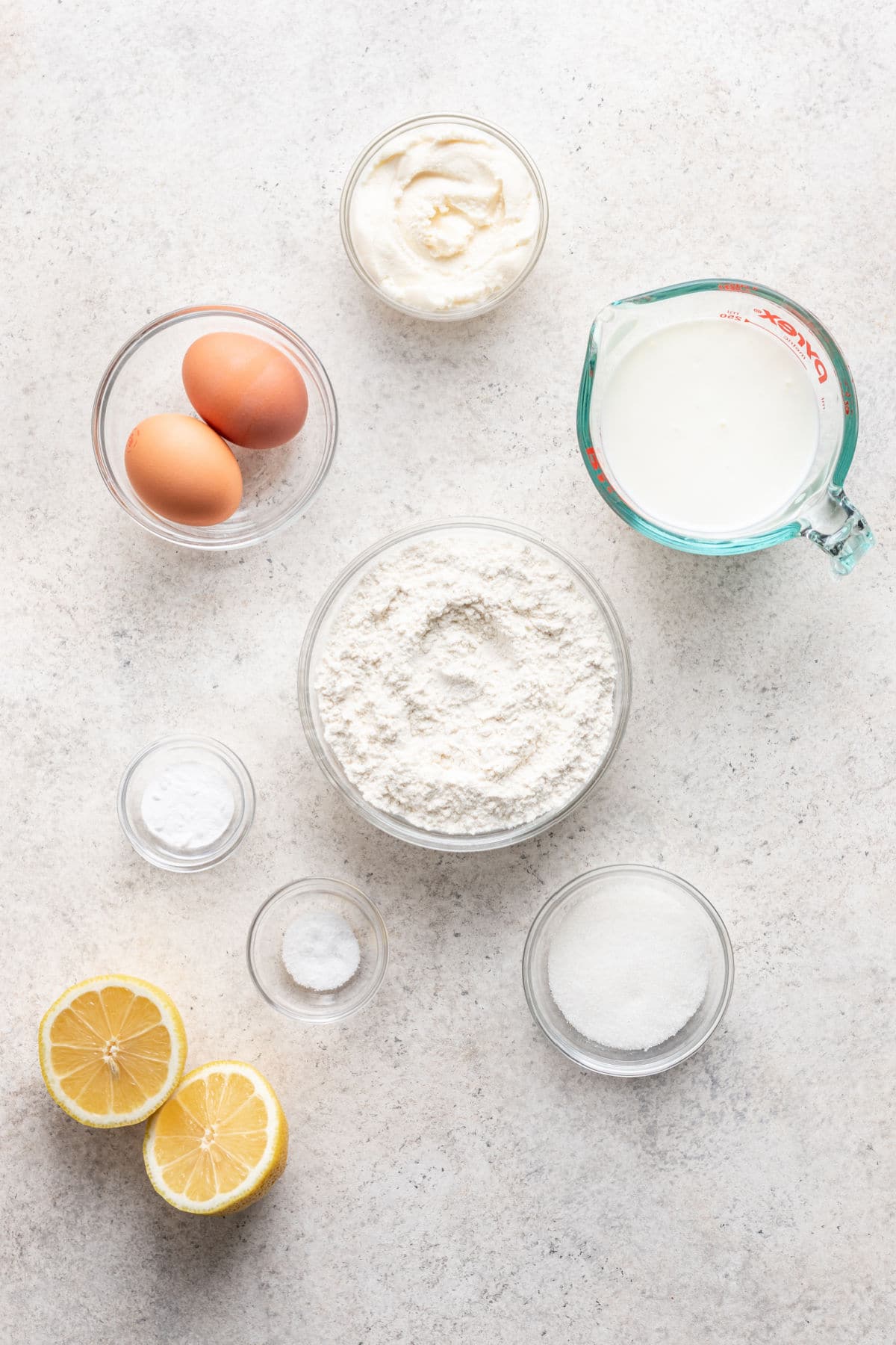 Ingredients for lemon ricotta pancakes in dishes. 