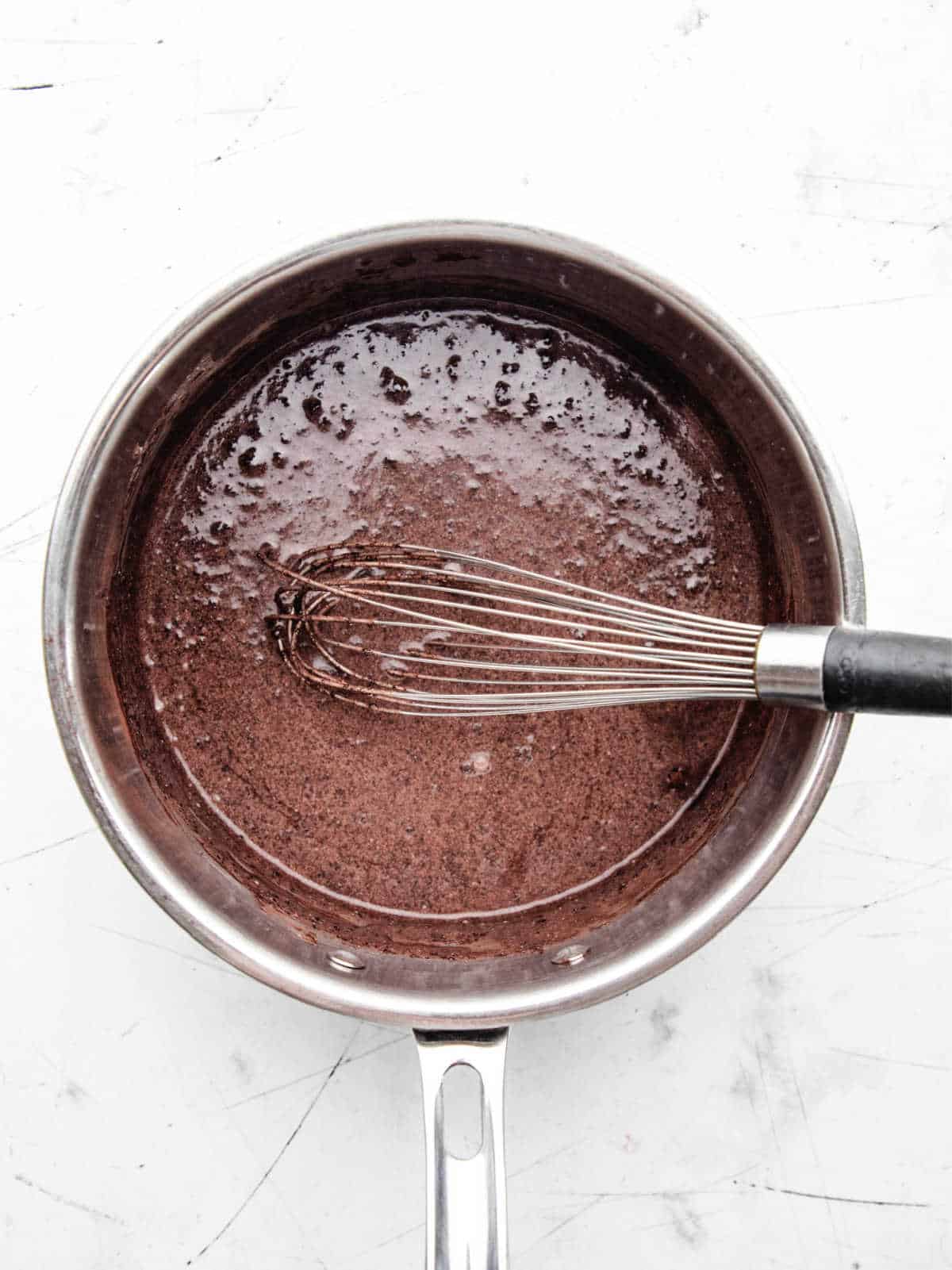 Heavy cream, brown sugar, and cocoa powder in a saucepan.
