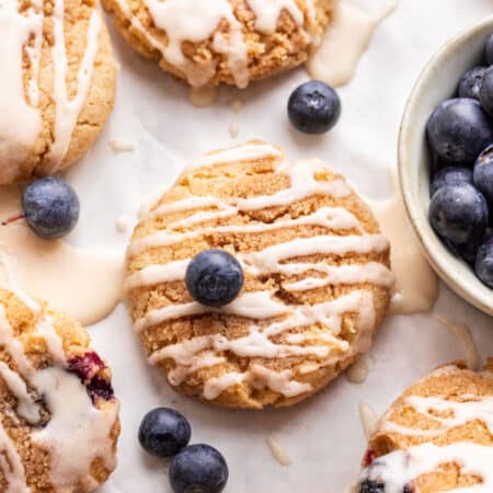 Blueberry muffin cookies topped with fresh blueberries.