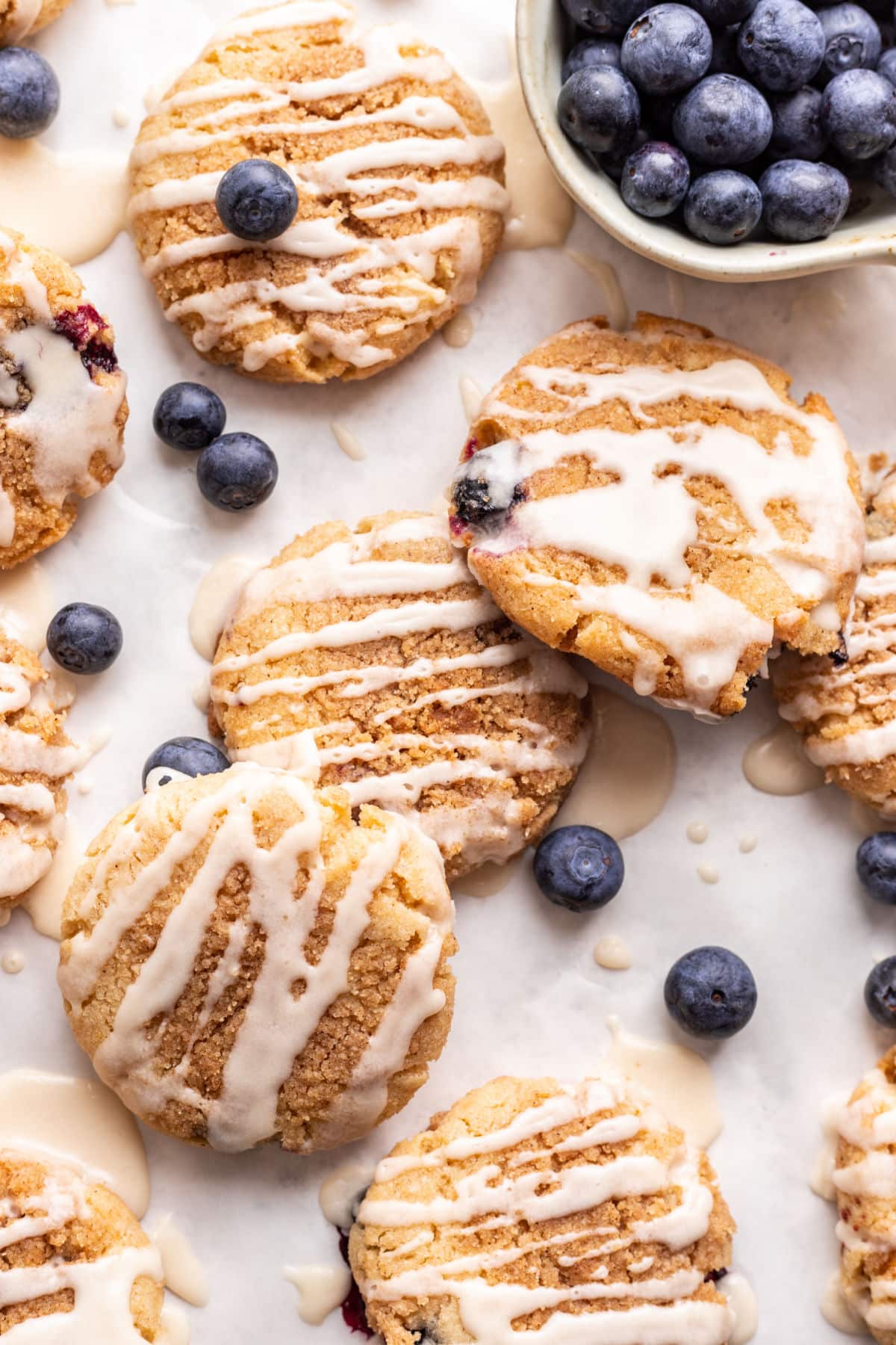 Blueberry muffin cookies drizzled with vanilla glaze. 