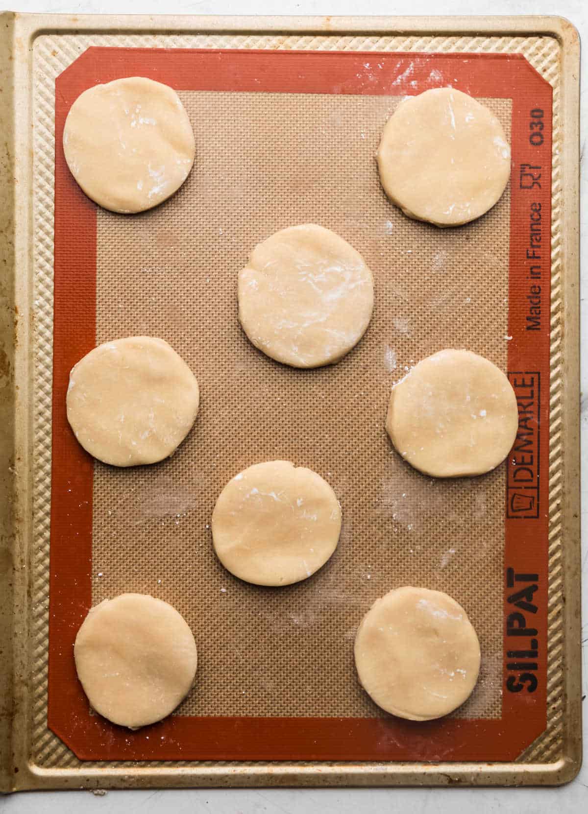 Sugar cookie dough on a silicone baking mat. 