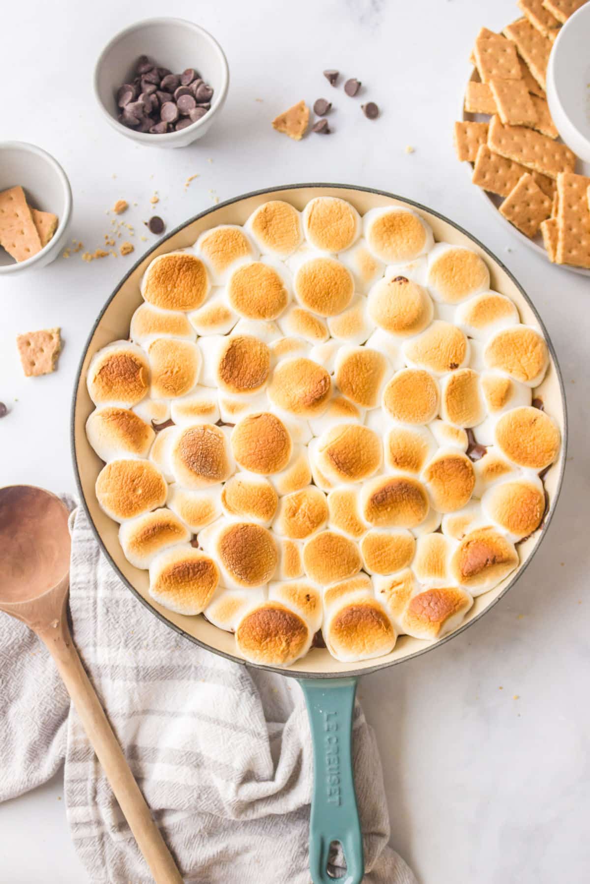 Baked s'mores dip in a cast iron skillet. 