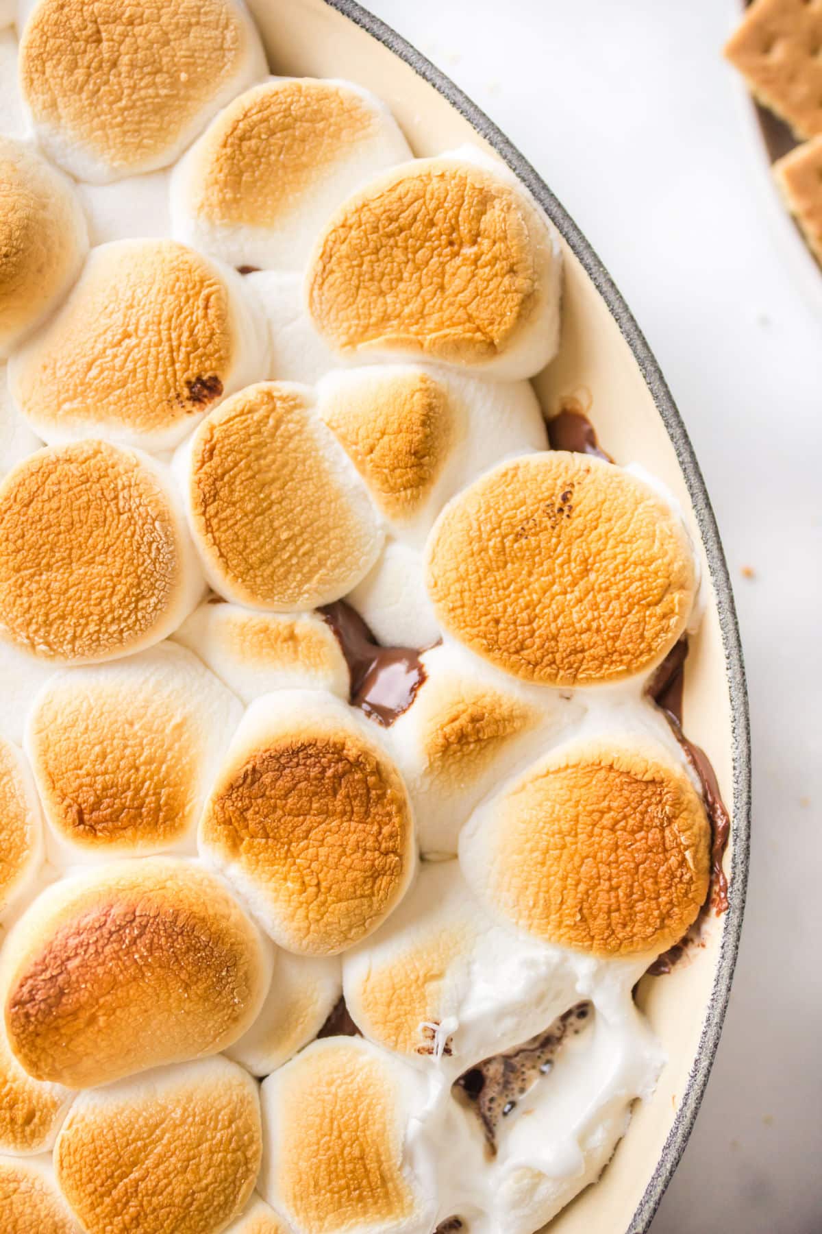 Close up of s'mores dip in a cast iron skillet. 