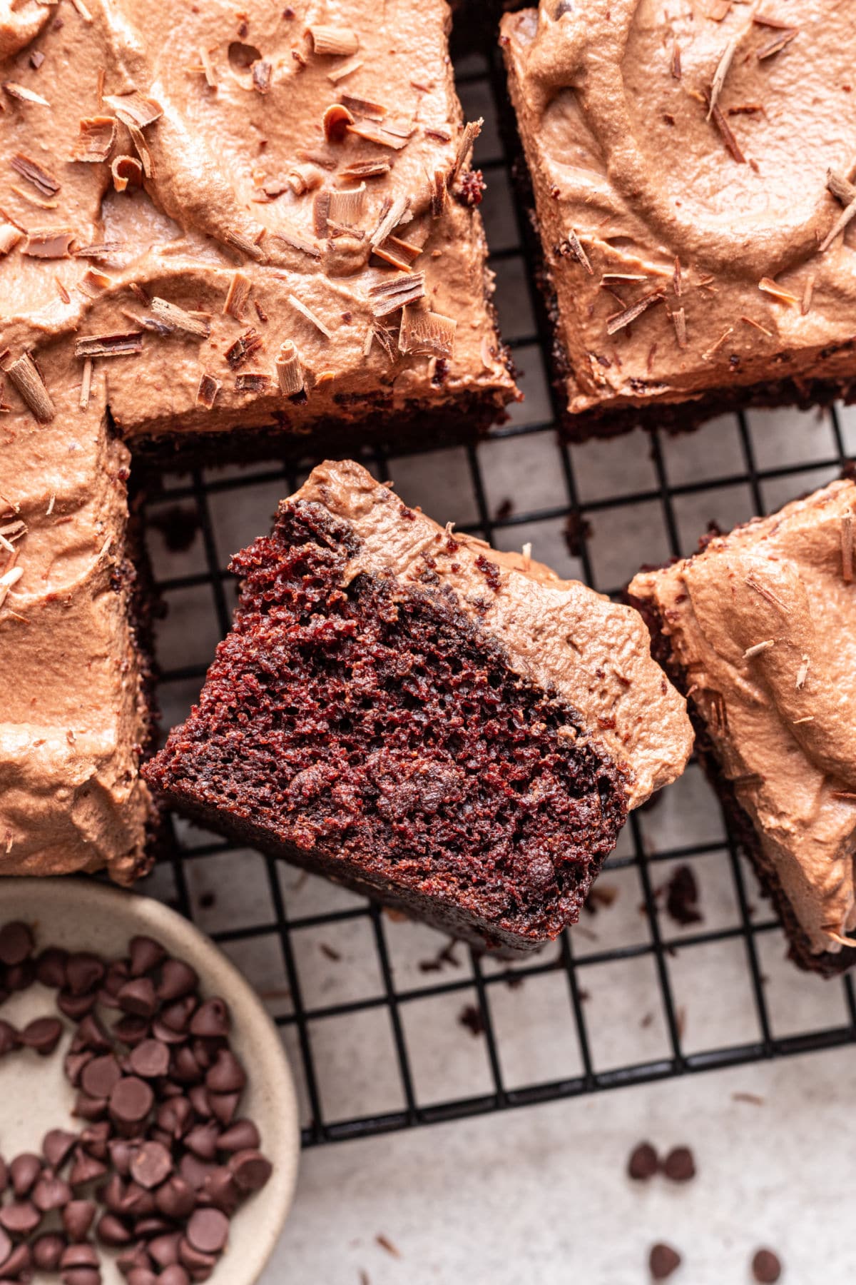 A slice of chocolate mousse cake on its side. 