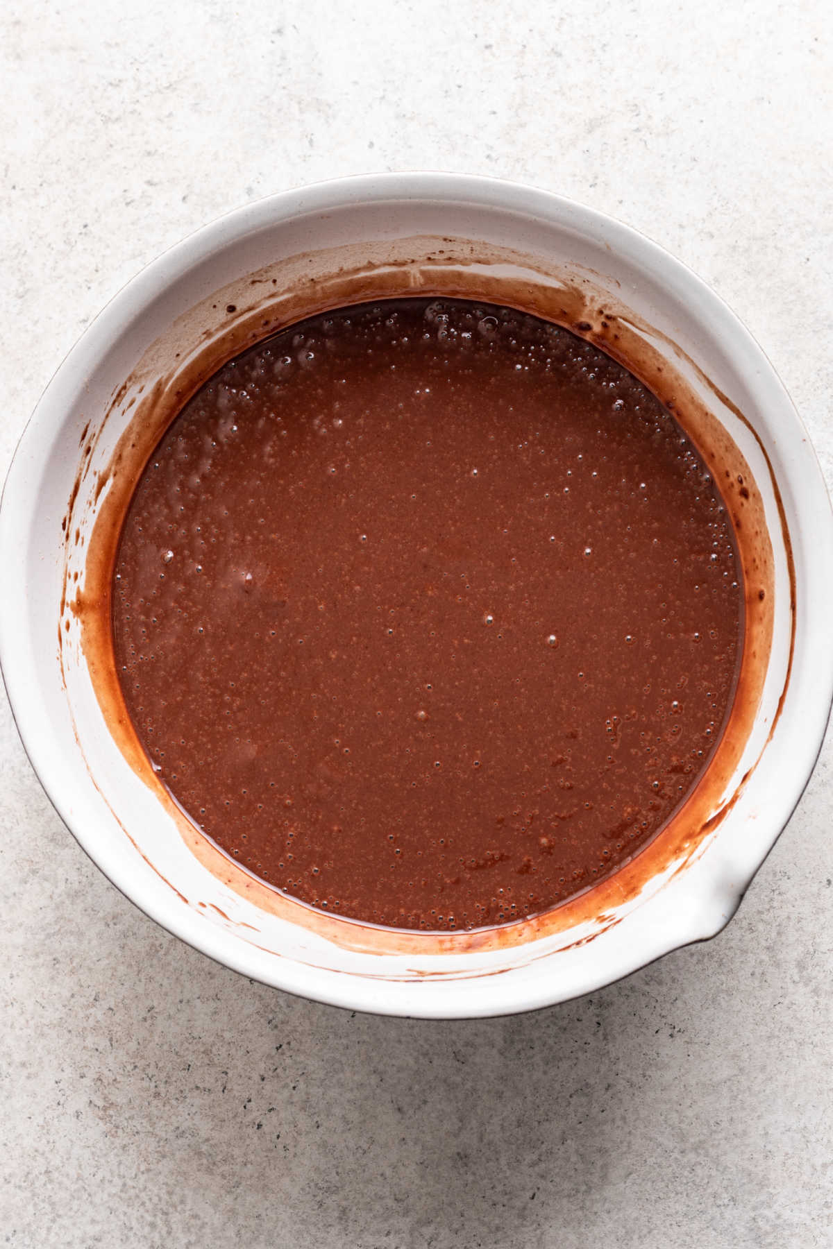 Hot water and vanilla whisked into chocolate mousse cake batter. 