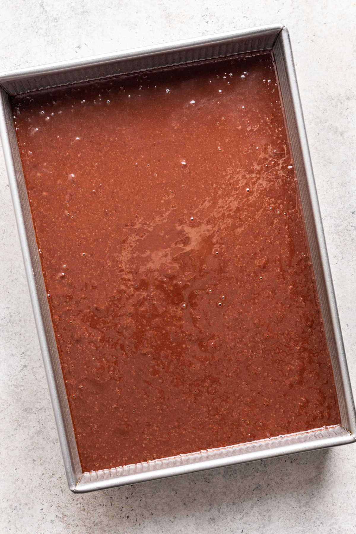 Chocolate mousse cake batter in a pan. 