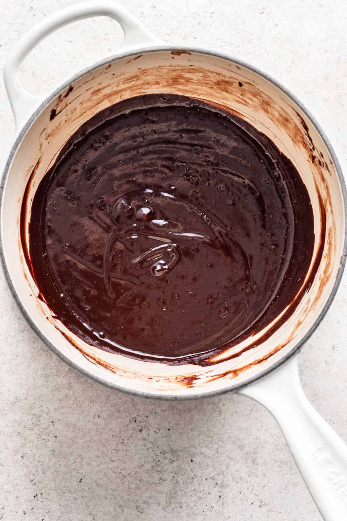 Melted chocolate and marshmallows in a saucepan.