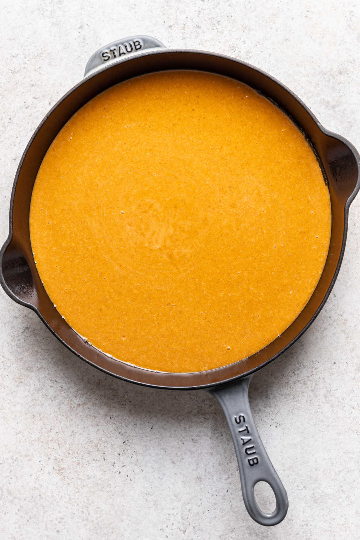 Pumpkin crisp filling in a cast iron skillet. 