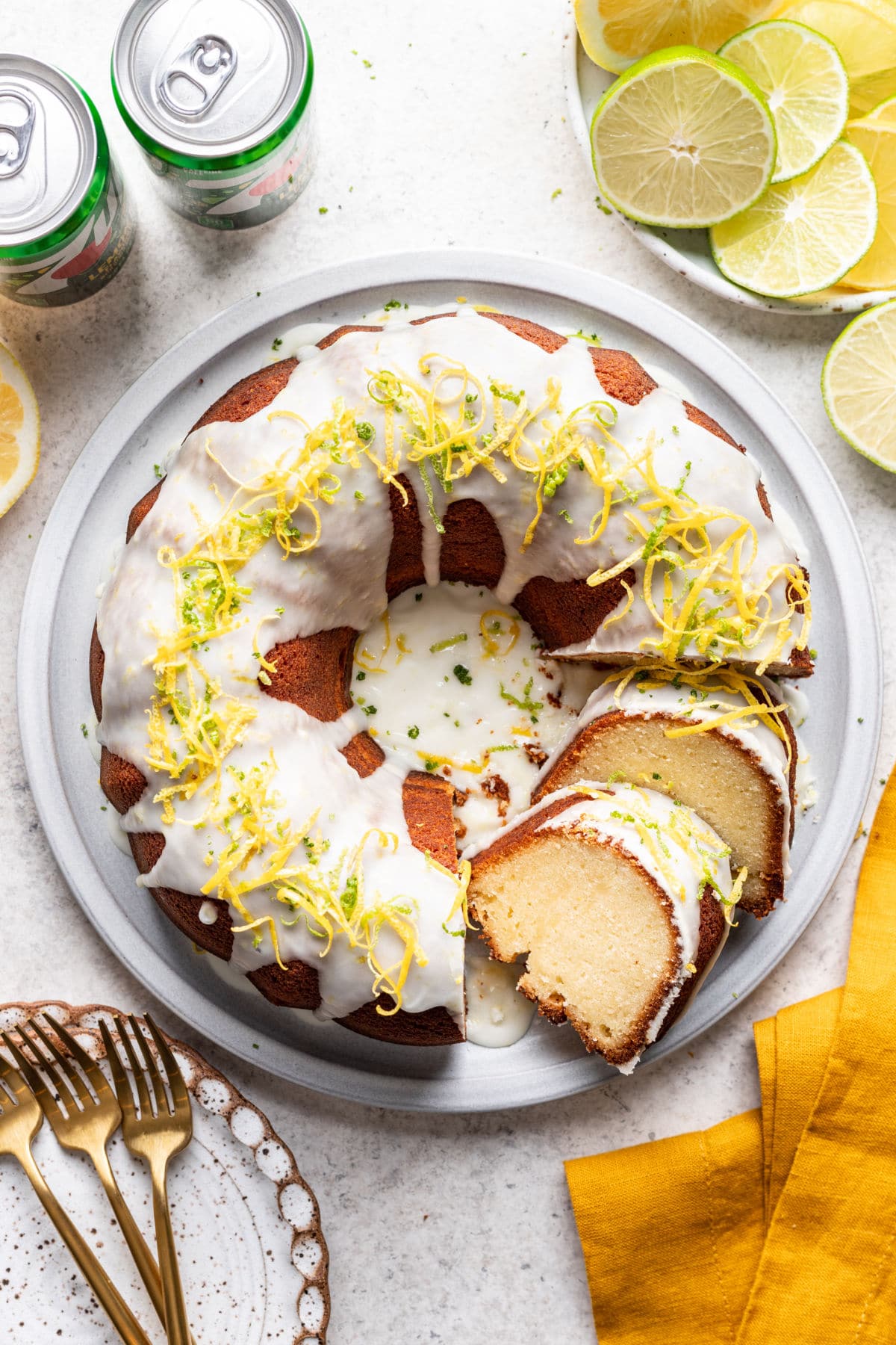 Two slices of 7 up pound cake leaning against the cake. 