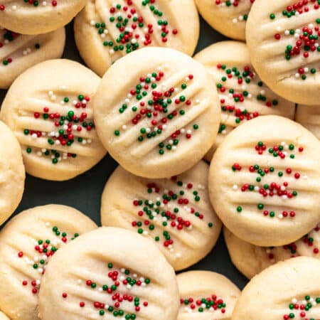 Whipped shortbread cookies topped with nonpareils.